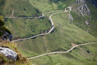 High angle view of road amidst green landscape