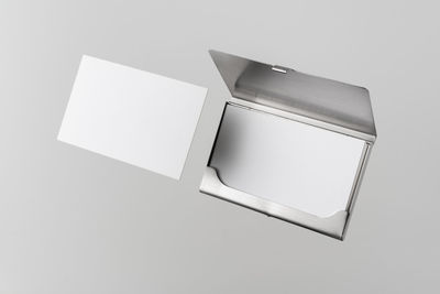 High angle view of paper board against white background