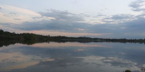 Scenic view of lake against sky during sunset