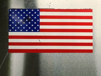 Close-up of american flag on metal