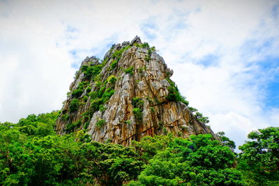 Low angle view of rock formation against sky