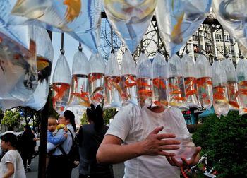 Group of people at market stall