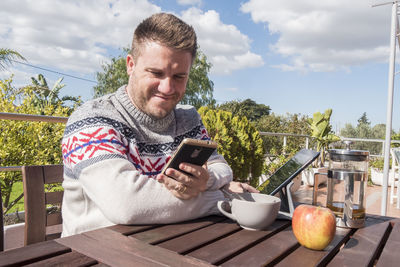 Young man using mobile phone