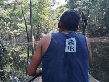 Rear view of man in forest