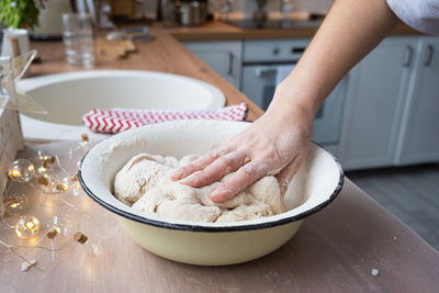 Cropped hand of person preparing food