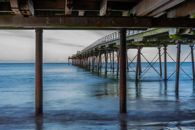 Pier over sea against sky