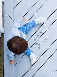 Young boy playing with his stone collection