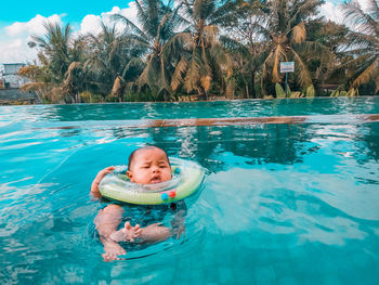 Boy swimming in pool