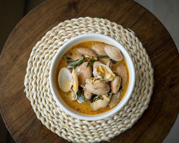 Chilli butter cream clam served in a bowl on a table.