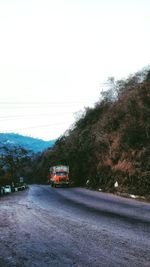 Car on road against clear sky