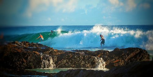 Waves splashing on rocks at seaside