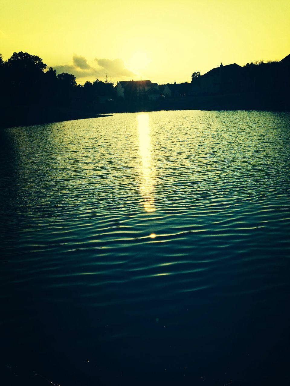 sunset, water, reflection, silhouette, sun, tranquil scene, scenics, waterfront, tranquility, lake, beauty in nature, sky, rippled, orange color, idyllic, nature, river, sunlight, outdoors, no people