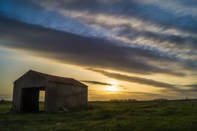 House against sky during sunset