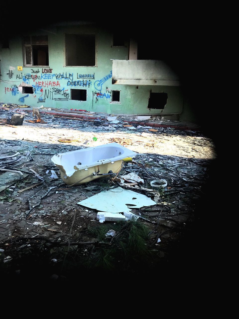 ABANDONED BUILDING BY BROKEN WALL