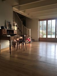 Empty chairs and table in room