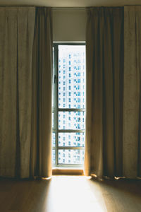 Closed window with curtains in a room