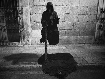 Shadow of woman walking on footpath