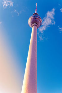 Low angle view of communications tower against sky