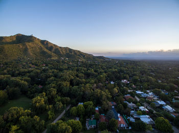 High angle view of trees and buildings against sky