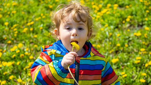 Portrait of cute girl holding flower