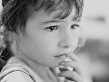 Close-up portrait of girl looking away