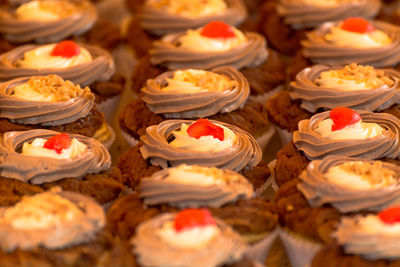 Full frame shot of cupcakes for sale in bakery