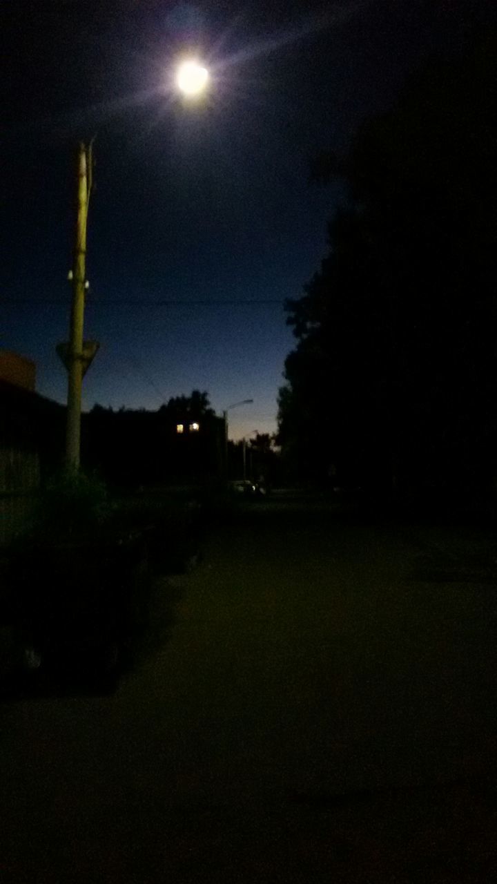 night, illuminated, street light, lighting equipment, sky, dark, tree, silhouette, moon, electricity, tranquility, dusk, light - natural phenomenon, nature, outdoors, tranquil scene, landscape, glowing, street, no people