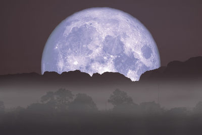 Scenic view of moon against sky at night