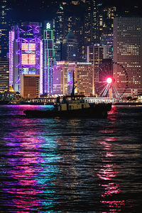 Illuminated buildings at waterfront