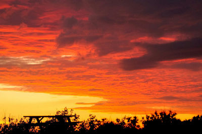 Low angle view of cloudy sky at sunset