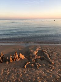 Scenic view of sea against sky at sunset