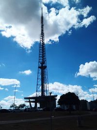 Low angle view of crane against blue sky