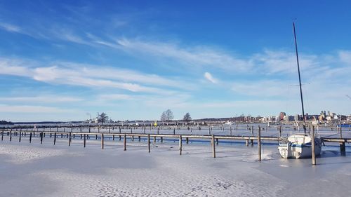 Pier over sea against sky