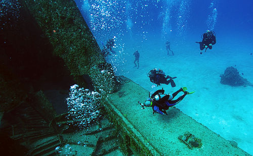 People swimming in sea