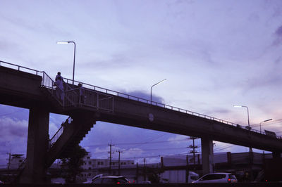 Low angle view of bridge against sky in city