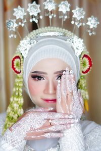 Portrait of young woman wearing wedding dress