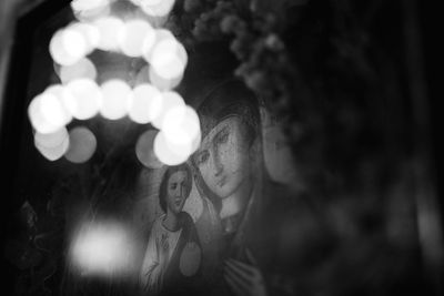 Full length portrait of woman standing at night