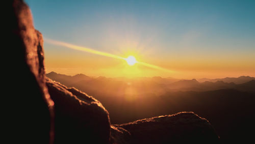 Scenic view of mountains against sky during sunset