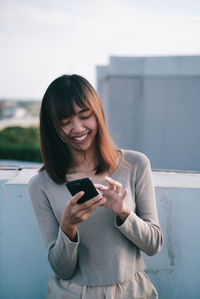 Young woman using mobile phone