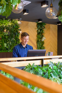 Portrait of man working on table