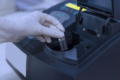 Close-up of hands working in factory