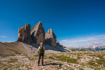 Full length of man on rock against sky