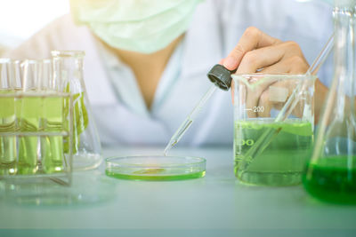 Midsection of woman working in laboratory