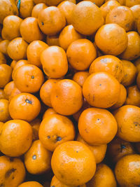 Full frame shot of oranges at market stall