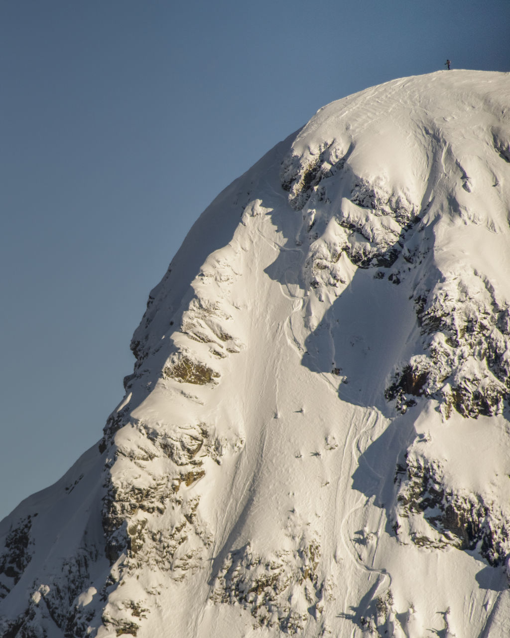 cold temperature, winter, snow, mountain, scenics - nature, beauty in nature, sky, white color, snowcapped mountain, tranquility, tranquil scene, environment, landscape, nature, clear sky, day, non-urban scene, frozen, sunlight, mountain range, no people, mountain peak, outdoors, extreme weather