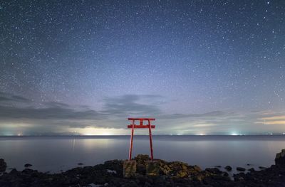 Scenic view of sea against sky at night