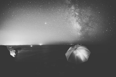 Scenic view of sea against sky at night