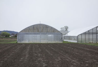 Built structure in greenhouse against clear sky