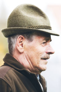 Close-up portrait of man wearing hat