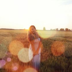 Woman standing on grassy field